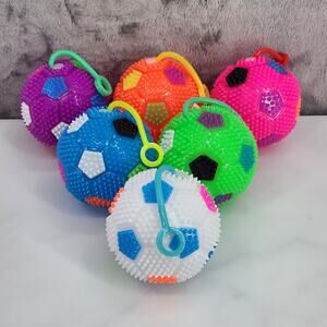 Pack of 6 Squishy Light-Up Spiky Soccer Balls that Squeak, Return & Flash